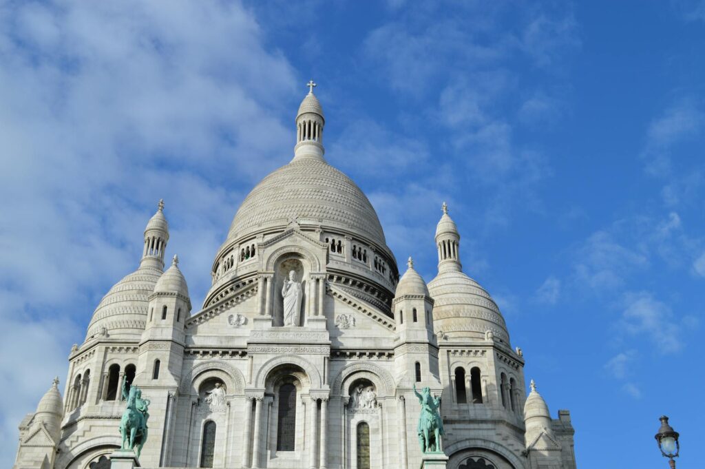 Gray and White Cathedral Under Cloudy Blue Sky